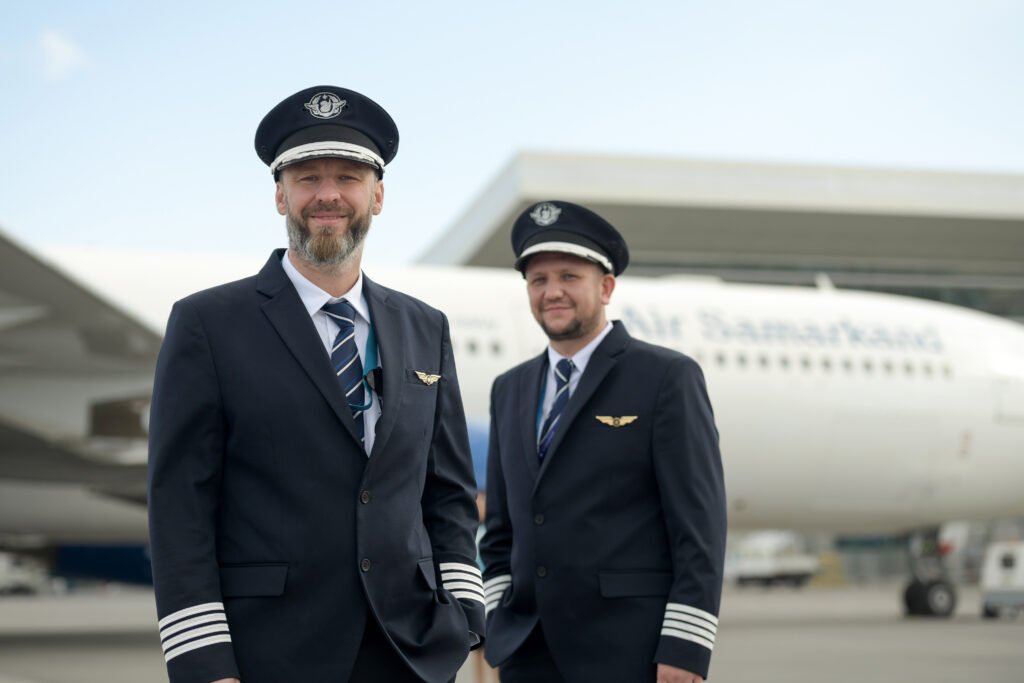 two-professional-airline-pilots-standing-front-aircraft